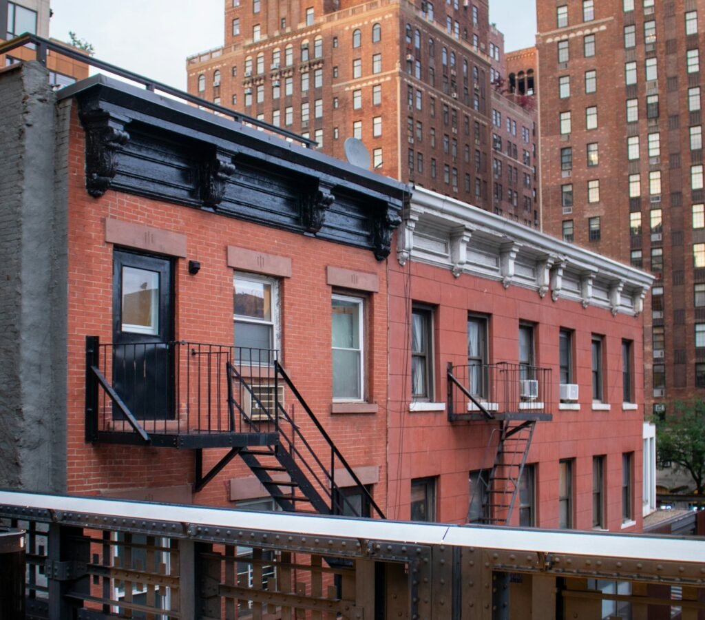 Chelsea NYC loft interior with brick walls, large factory windows, and an art-forward modern style